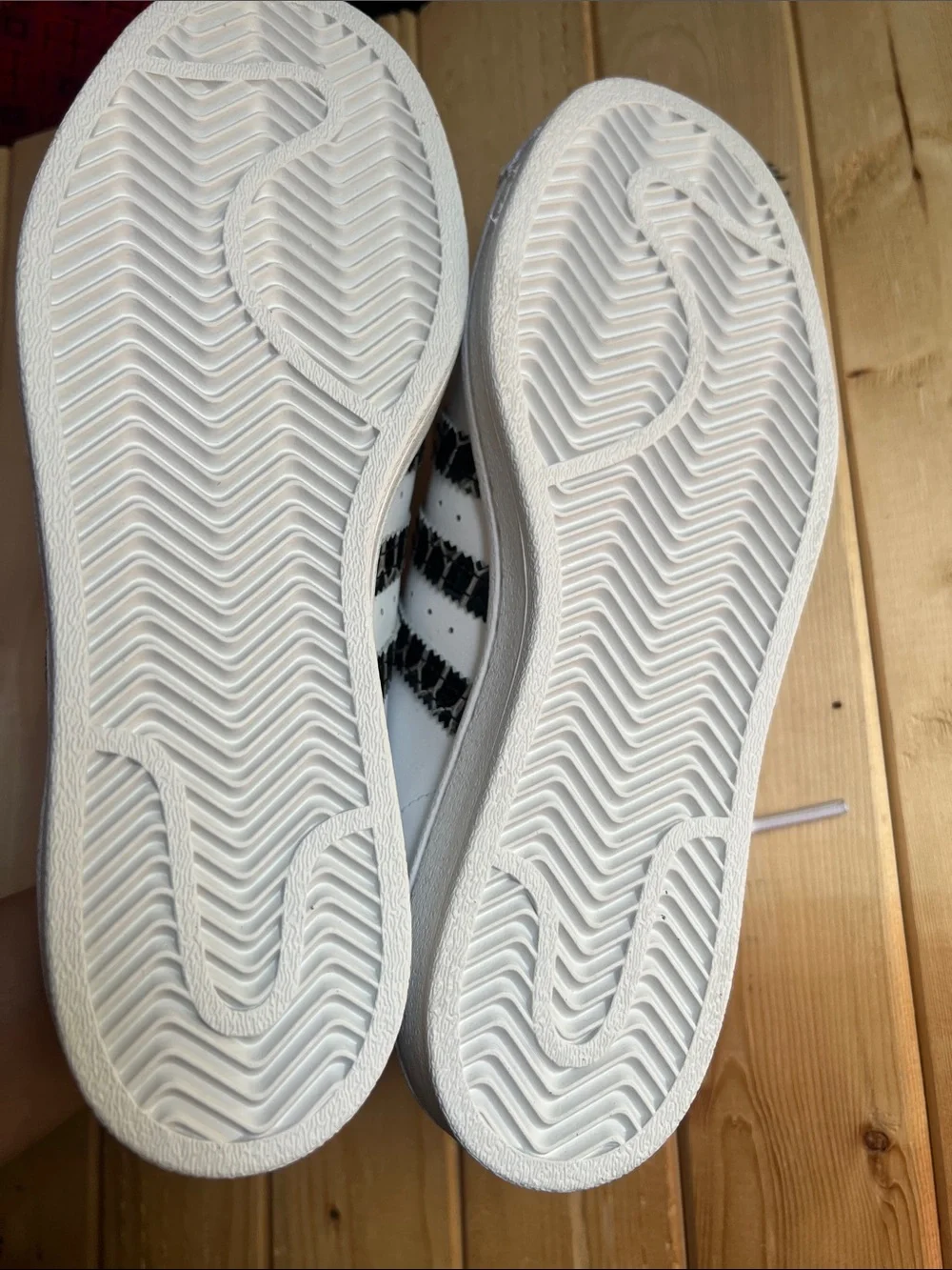 White Superstar Sneakers with Black Snakeskin Stripes